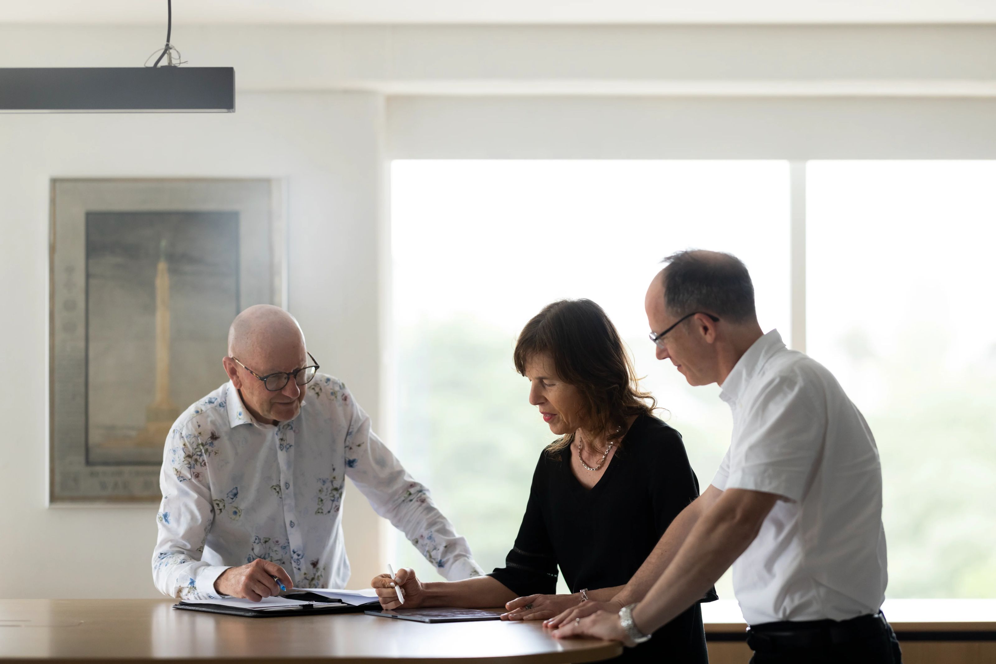 Ministry team reviewing drawings together at a meeting table